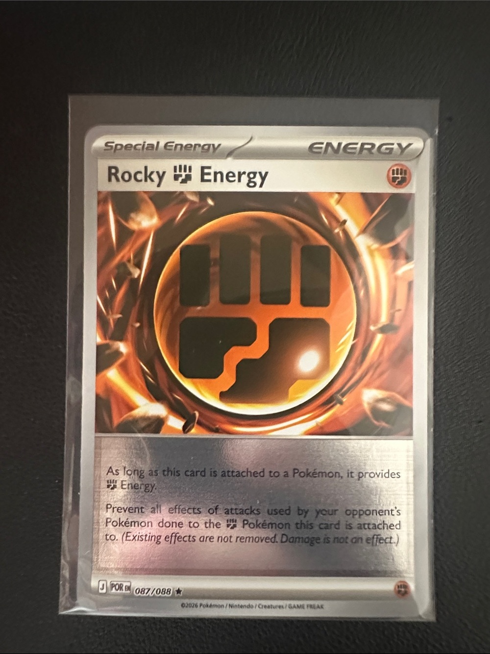 Rocky Energy Pokémon Special Energy Card - Orange & Black
